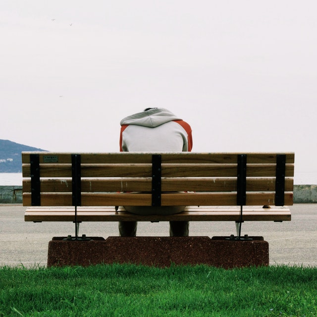 Brooding on a park bench 